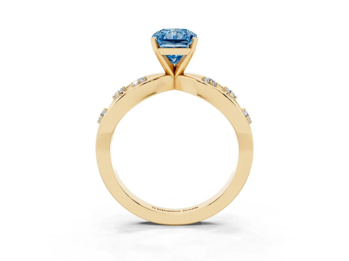 Fancy Blue Radiant Cut Cut Solitaire Diamond with Side Stones on Criss-Cross Band and Four-Prong Setting Yellow gold