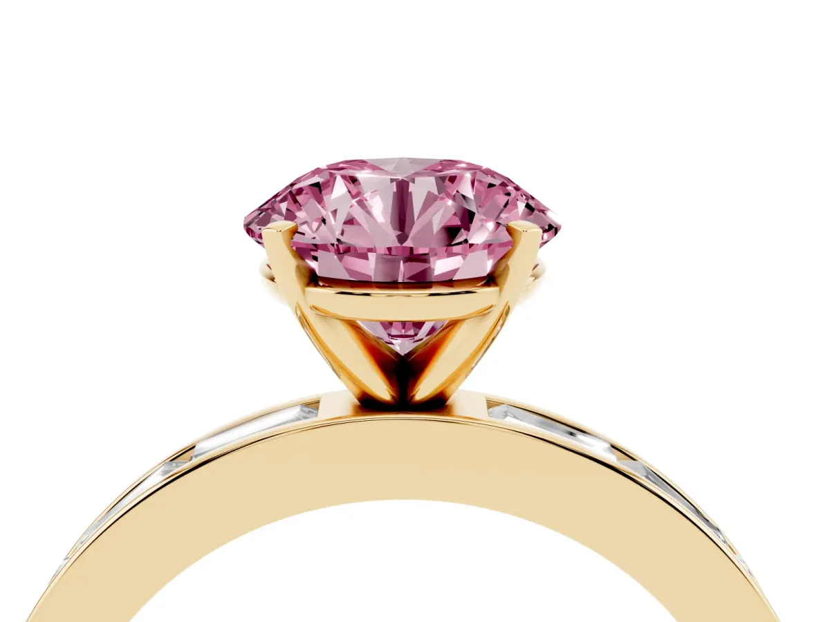 Fancy Pink Round Cut Solitaire Diamond Ring with Channel-Set Baguette Band and Four-Prong Setting Yellow gold