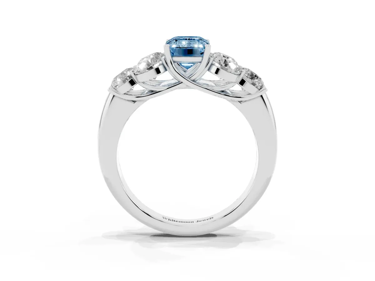 Fancy Blue Emerald Cut Cut Diamond Cluster Ring with Round Accent Stones and Prong Setting on a Classic Band White gold