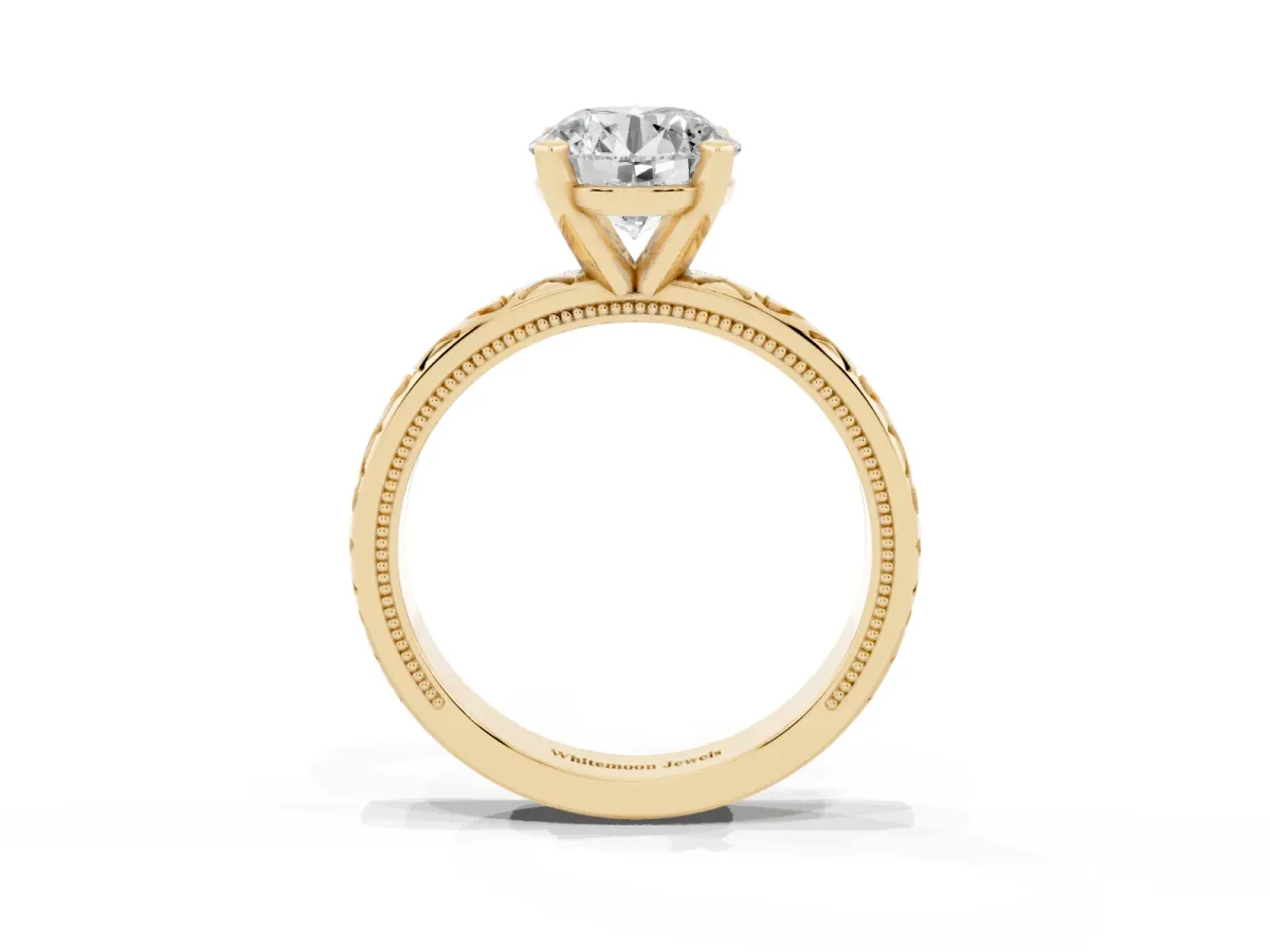 Round Cut Solitaire Diamond Engagement Ring with XO Engraved Band and Four-Prong Setting Yellow gold