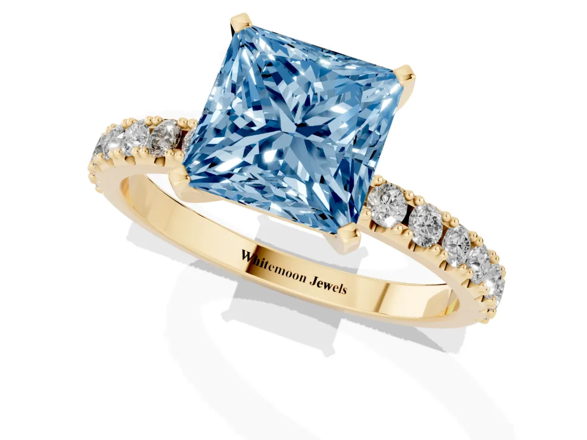 Fancy Blue Princess Cut Diamond Solitaire Pavé Band with Four-Prong Setting Yellow gold