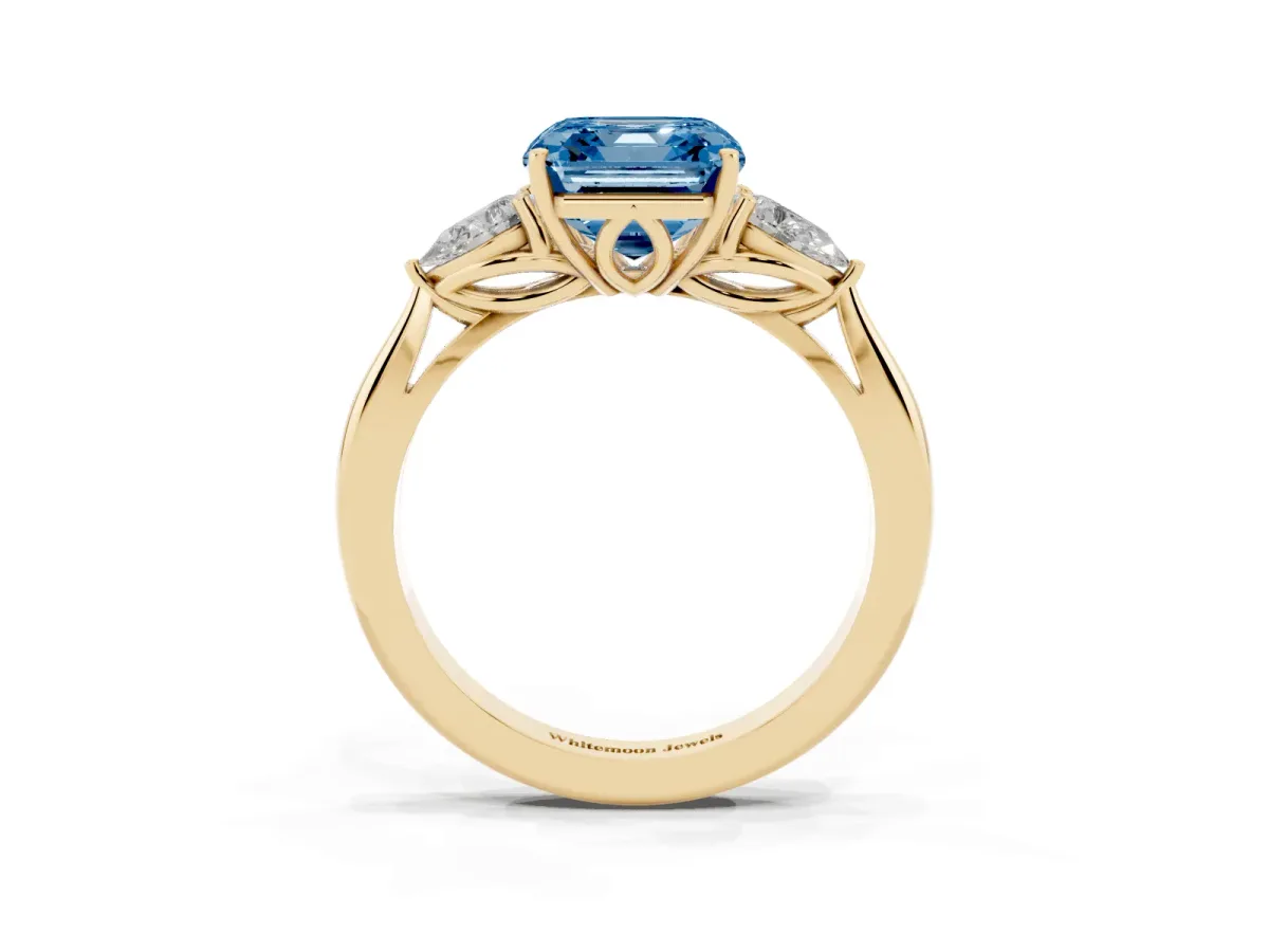 Fancy Blue Three-Stone Asscher Cut Brilliant Diamond Solitaire Ring with Tapered Band and Four-Prong Setting Yellow gold