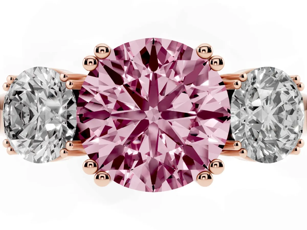 Fancy Pink Three-Stone Round Cut Cut Diamond Ring with Channel Set Band and Four-Prong Setting Rose gold