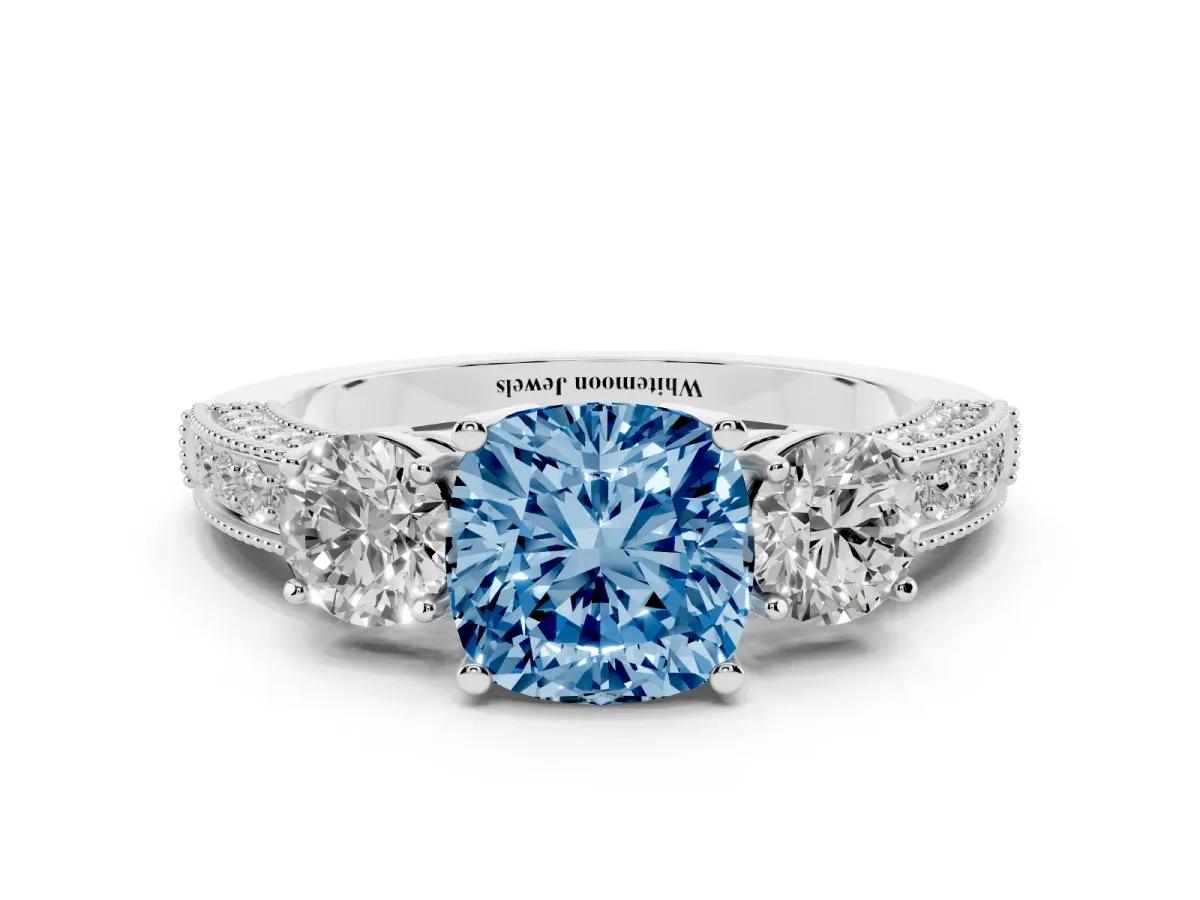 Fancy Blue Cushion Cut Three-Stone Diamond Ring with Pavé Band and Four-Prong Setting Silver