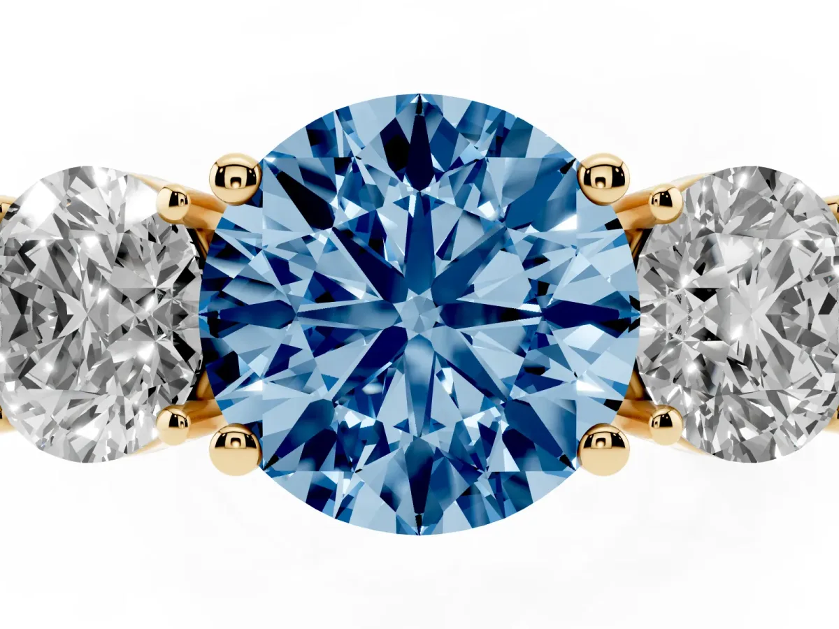 Fancy Blue Three-Stone Round Cut Cut Diamond Engagement Ring with Flat Band and Four-Prong Setting Yellow gold