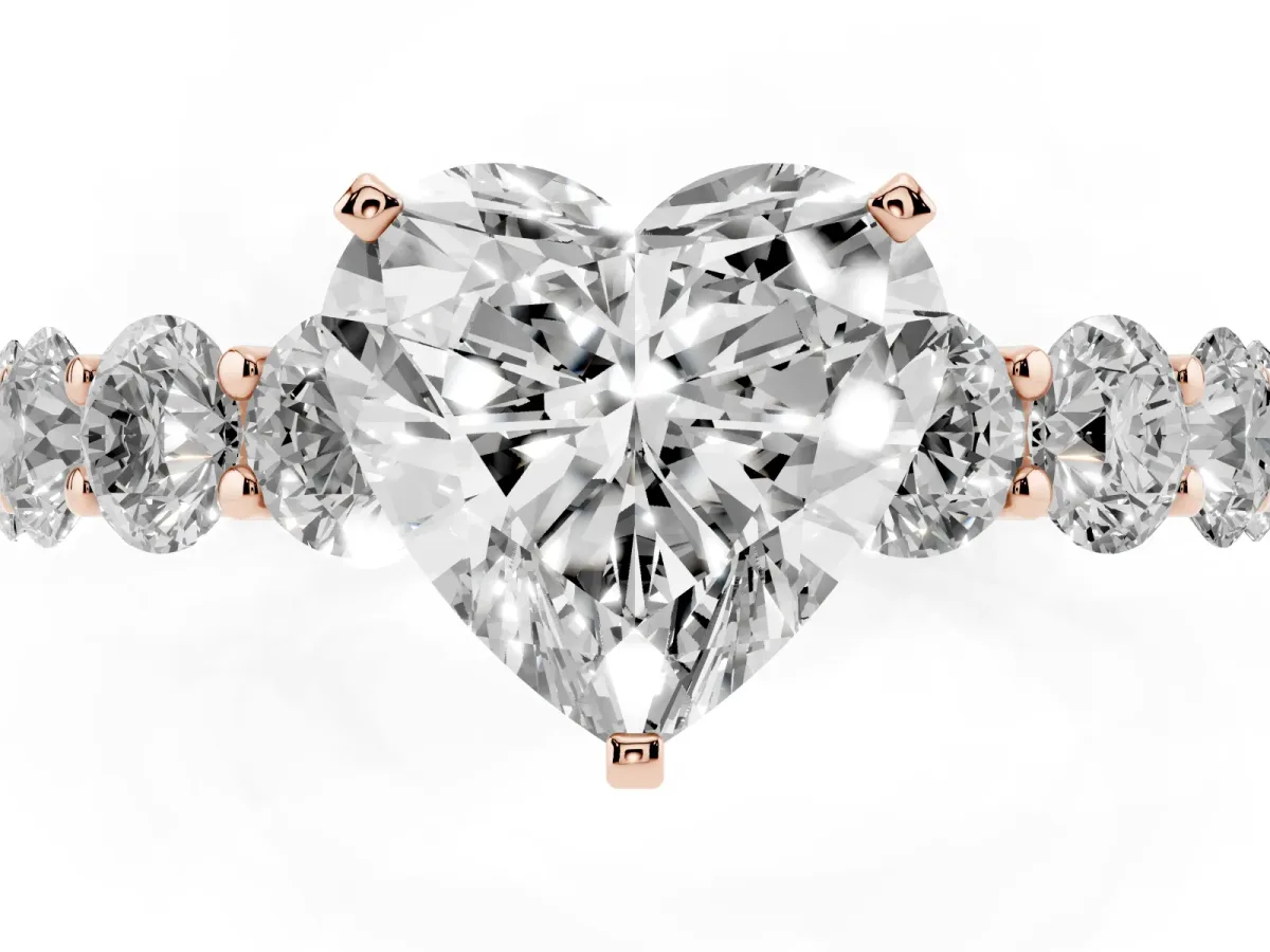 Heart Cut Diamond Prong Setting with Side Stones on a Pave Band Rose gold