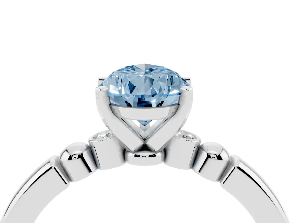 Fancy Blue Pear Cut Solitaire Beaded Band with Four-Prong Setting Silver