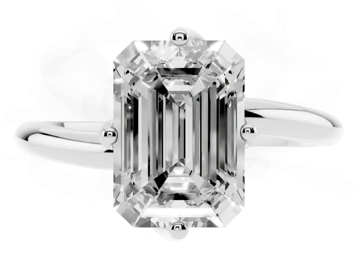 Emerald Cut Diamond Solitaire Engagement Ring with Four-Prong Setting and Classic Band Silver