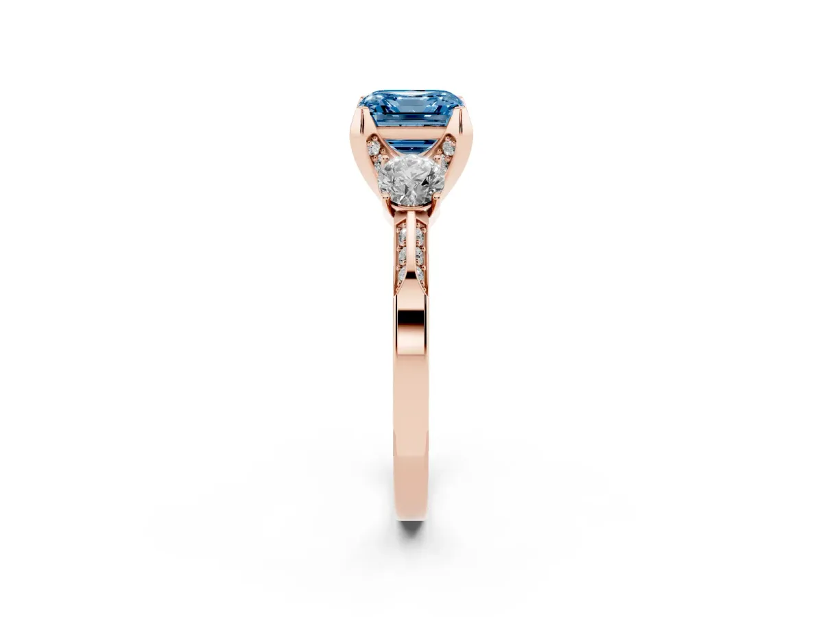 Fancy Blue Asscher Cut Brilliant Three-Stone Diamond Ring with Pavé Band and Four-Prong Setting Rose gold