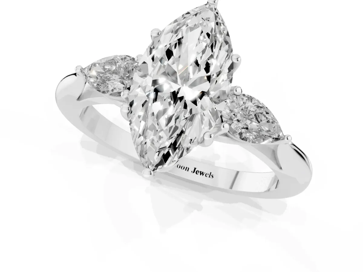 Three-Stone Marquise Cut Diamond Ring with Pear Side Stones in Four-Prong Setting Platinum