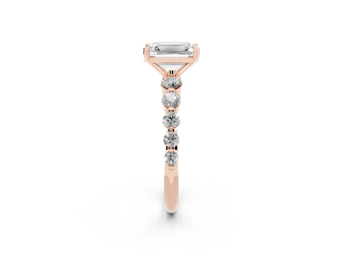 Emerald Cut Solitaire Diamond Ring with Pave Band and Four-Prong Setting Rose gold