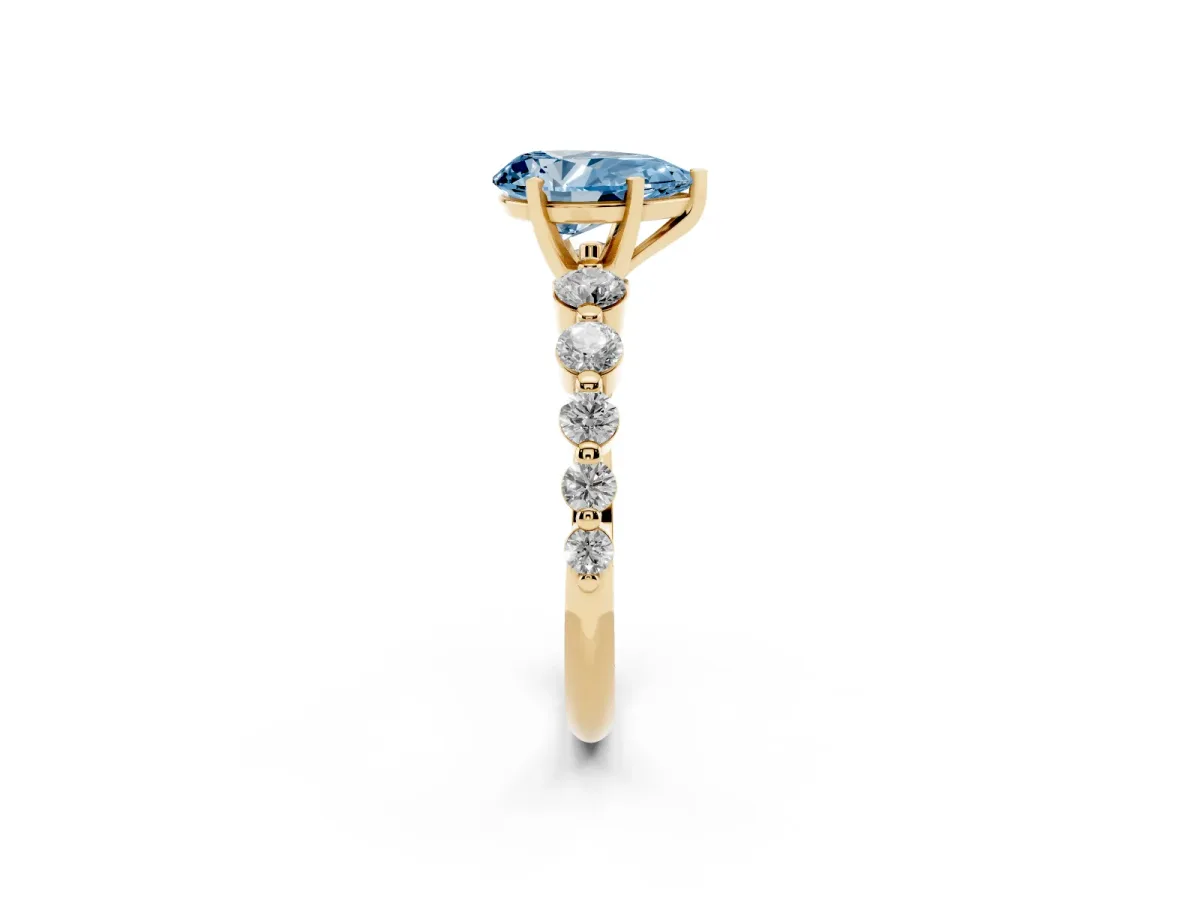 Fancy Blue Pear Cut Solitaire Diamond Ring with Pave Band and Four-Prong Setting Yellow gold