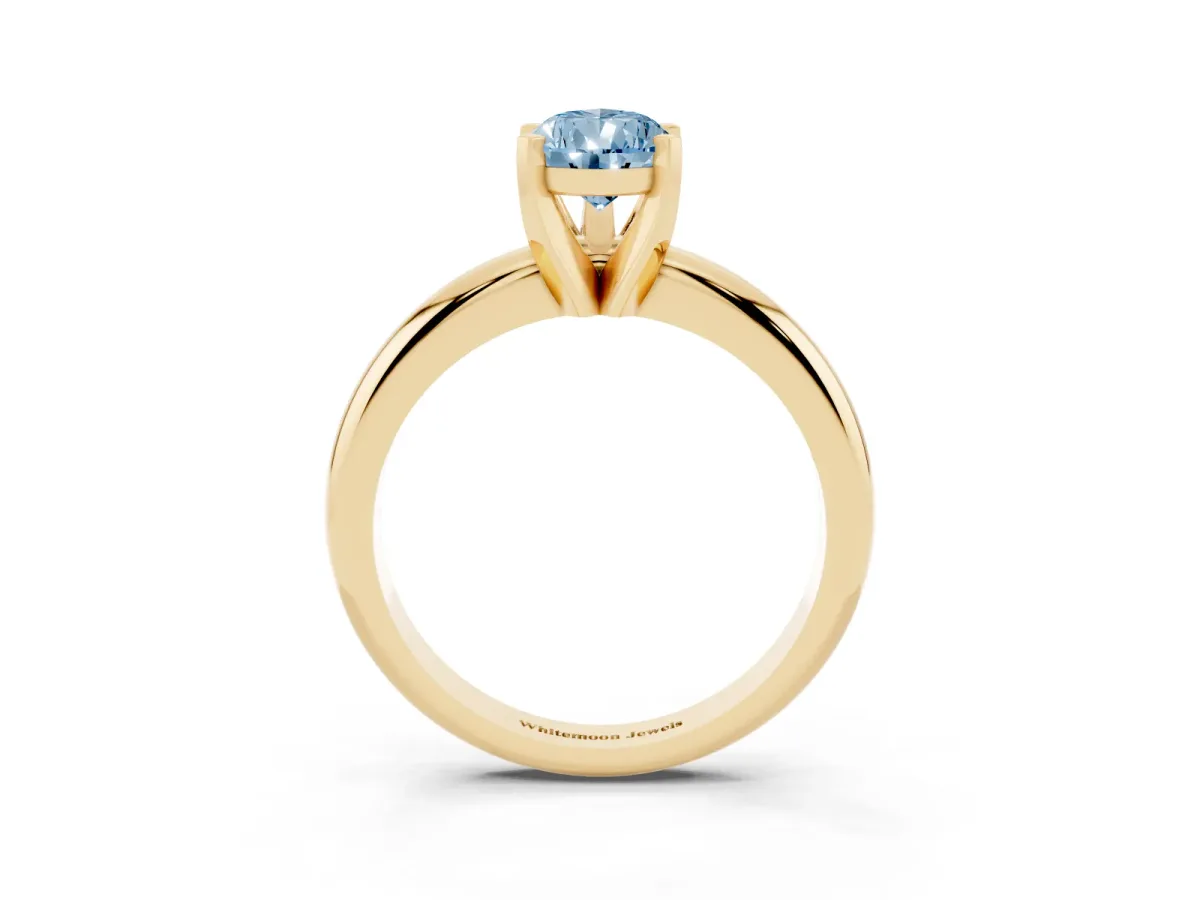 Fancy Blue Pear Cut Diamond Solitaire Engagement Ring with Round Band and Four-Prong Setting Yellow gold