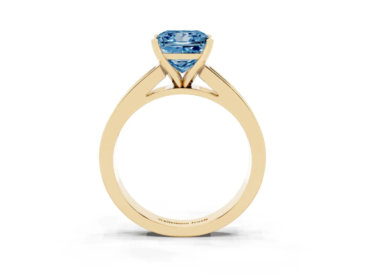 Fancy Blue Princess Cut Solitaire Diamond Ring with Channel-Set Band and Four-Prong Setting Yellow gold