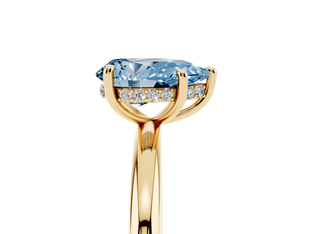 Fancy Blue Pear Cut Diamond Solitaire Ring with Thin Band and Four-Prong Setting Yellow gold