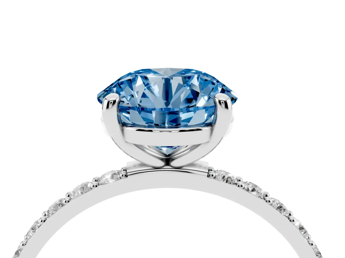 Fancy Blue Round Cut Diamond Solitaire Ring with Round Pavé Band and Prong Setting Silver