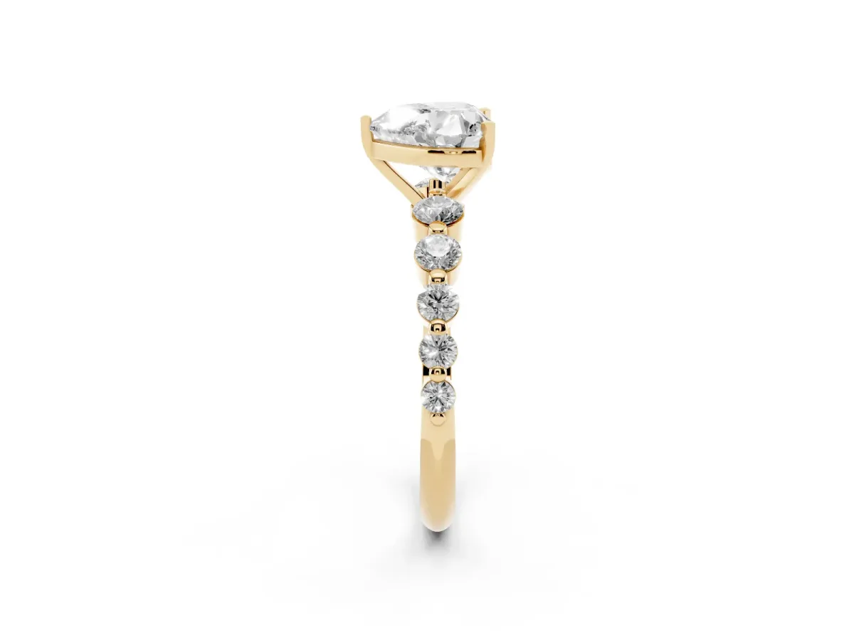 Heart Cut Solitaire Diamond Ring with Pave Band and Four-Prong Setting Yellow gold