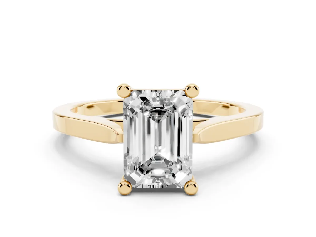 Emerald Cut Solitaire Diamond Ring with Four-Prong Setting and Tapered Band Yellow gold