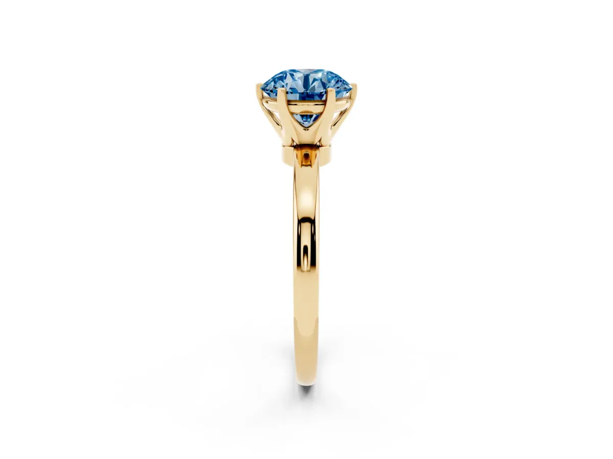 Fancy Blue Round Cut Solitaire Diamond Ring with Six-Prong Setting on a Classic Band Yellow gold