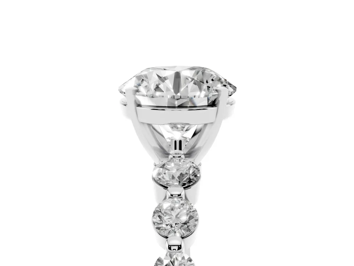 Round Cut Solitaire Diamond Ring with Pave Band and Four-Prong Setting Silver