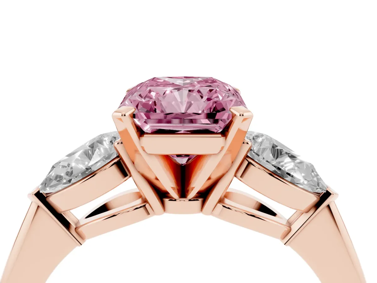 Fancy Pink Three-Stone Radiant Cut Diamond Ring with Pear Side Stones and Four-Prong Setting Rose gold
