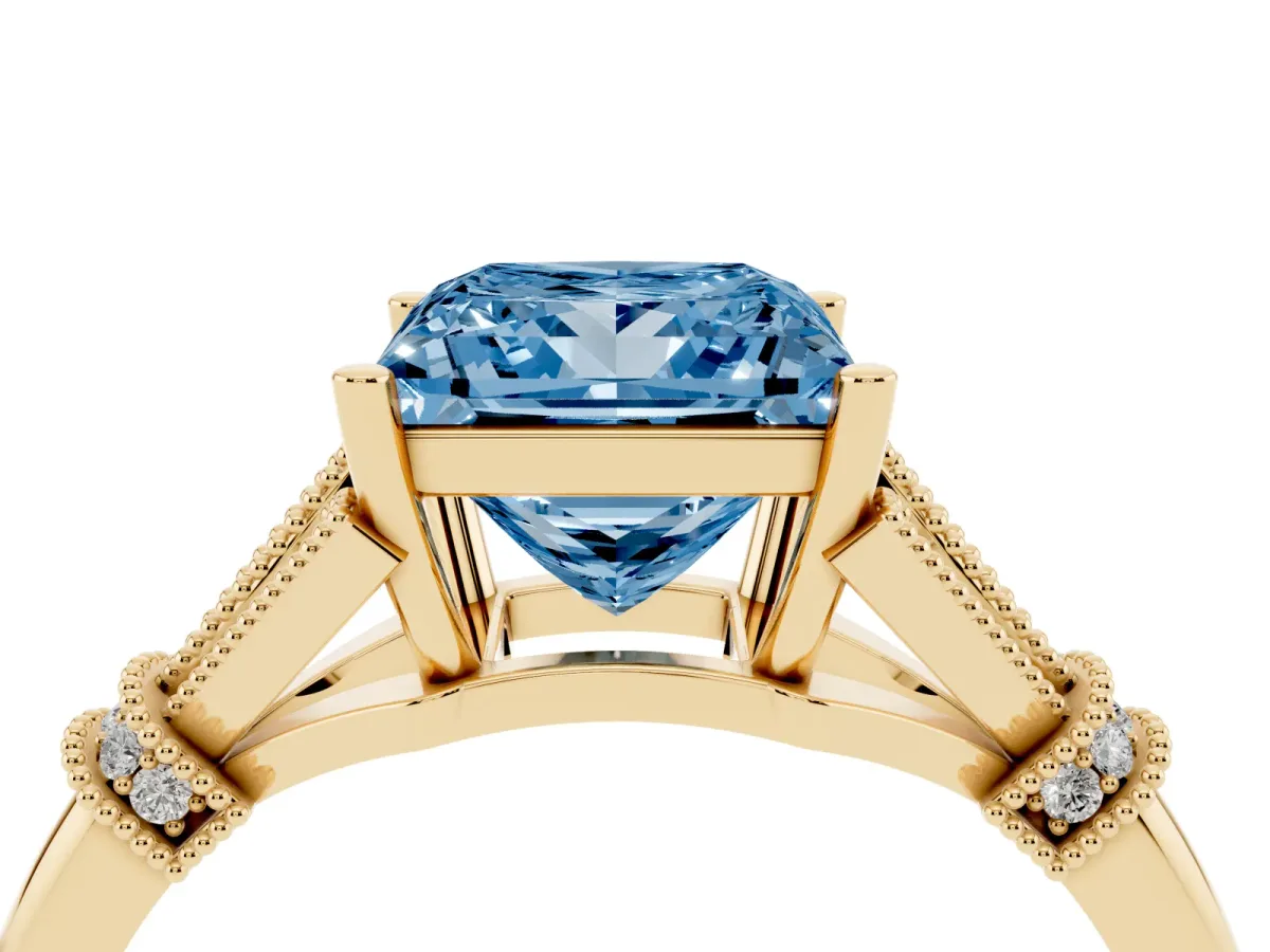 Fancy Blue Princess Cut Diamond Solitaire Ring with Floral Filigree and Pave Accents Yellow gold
