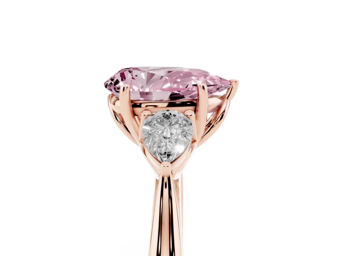 Fancy Pink Three-Stone Pear Cut Diamond Ring with Pear Side Stones in Four-Prong Setting Rose gold