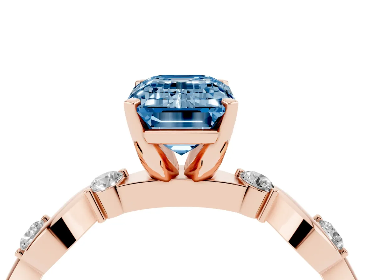 Fancy Blue Emerald Cut Diamond Solitaire Twisted Band with Round Accents and Prong Setting Rose gold