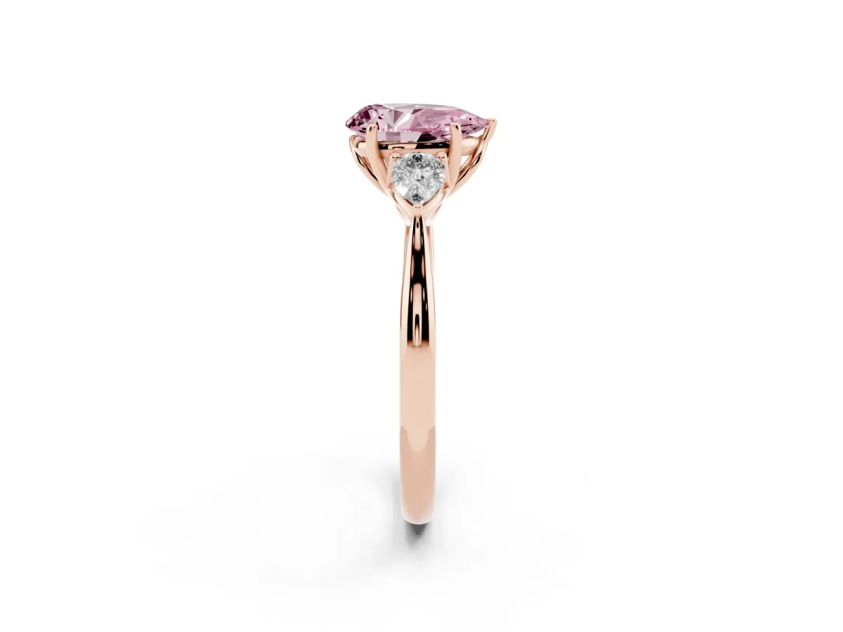 Fancy Pink Three-Stone Pear Cut Brilliant Diamond Solitaire Ring with Tapered Band and Four-Prong Setting Rose gold