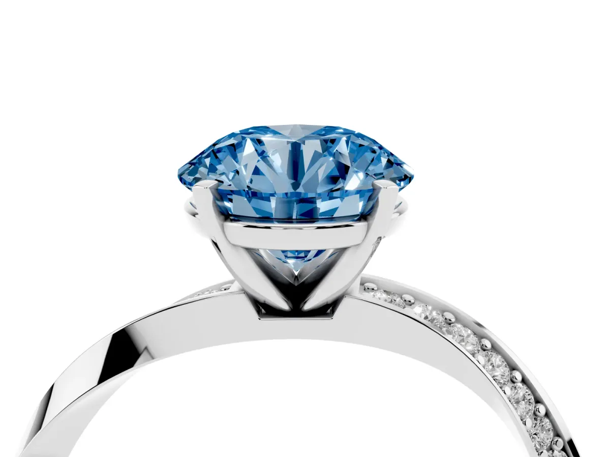 Fancy Blue Round Cut Diamond Engagement Ring with Side Stone Accents and Four-Prong Setting Silver