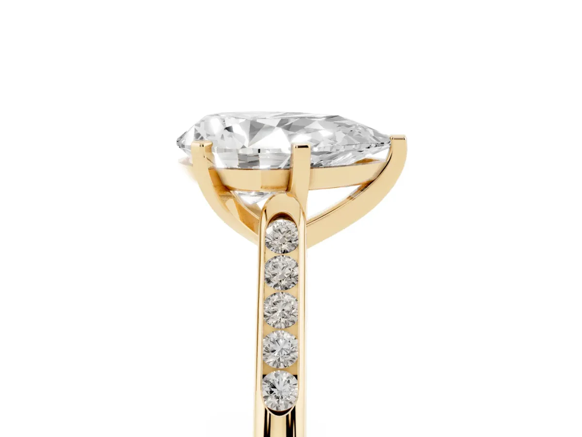 Pear Cut Diamond Solitaire Ring with Channel Set Round Band and Prong Setting Yellow gold