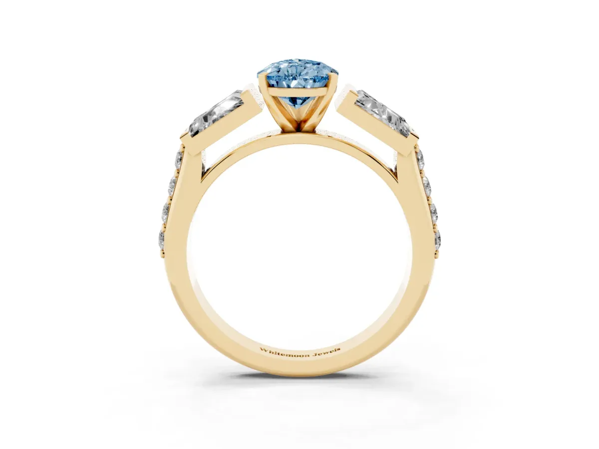 Fancy Blue Pear Cut Diamond Engagement Ring with Baguette Side Stones and Channel Set Band Yellow gold