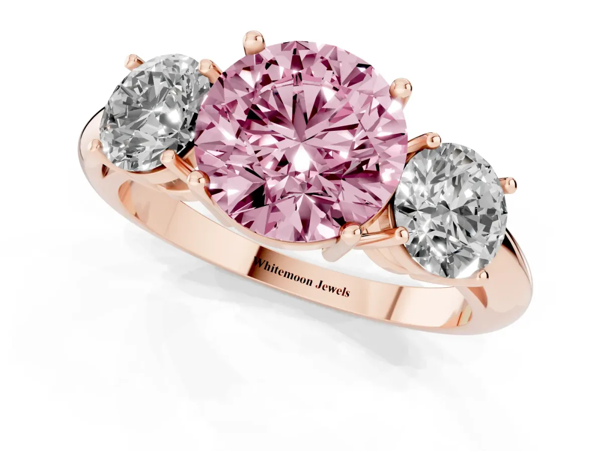 Fancy Pink Three-Stone Round Cut Cut Diamond Engagement Ring with Prong Setting on a White Gold Band Rose gold
