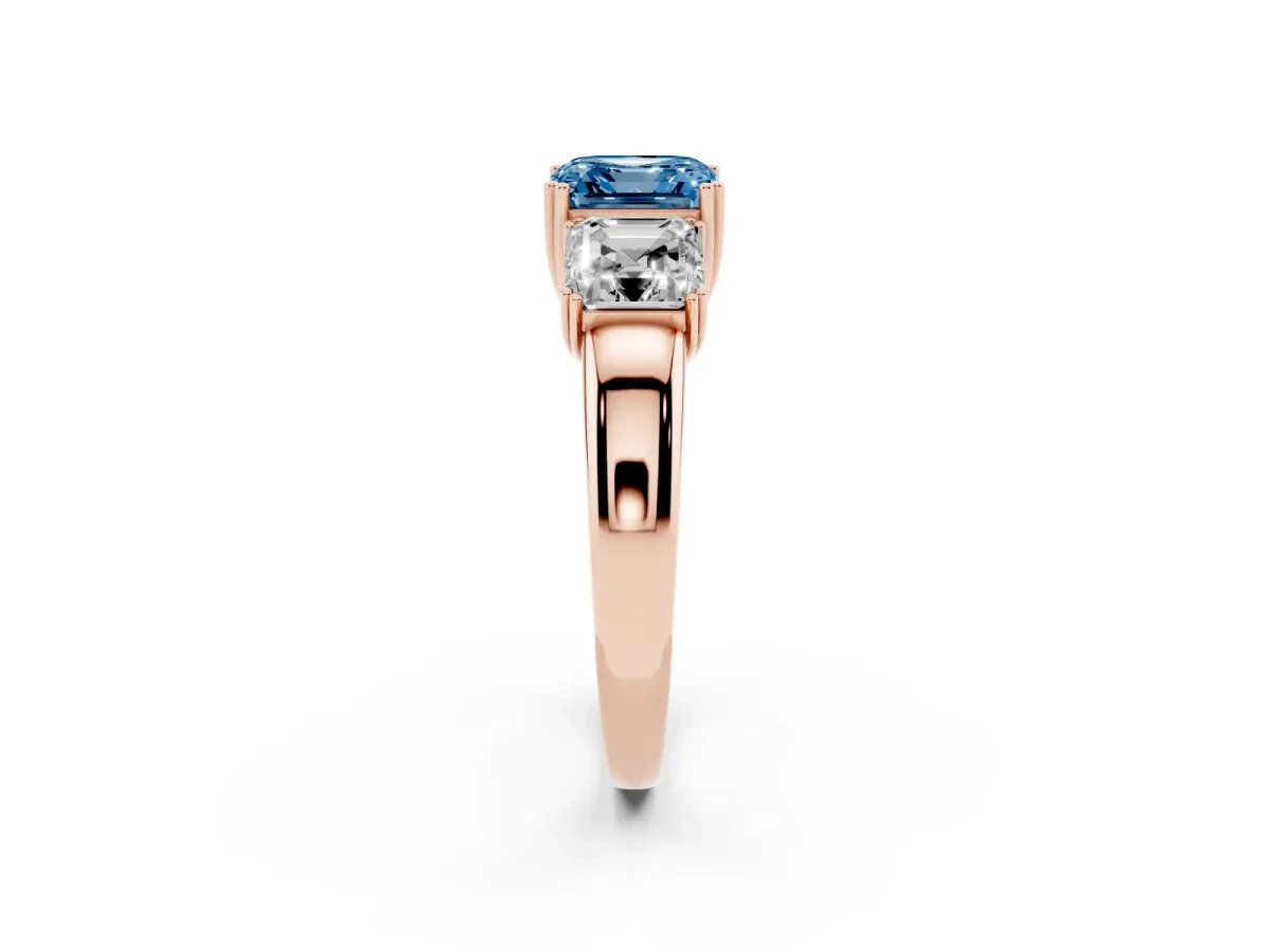 Fancy Blue Three-Stone Asscher Cut Cut Diamond Ring with Channel Set Band and Four-Prong Setting Rose gold