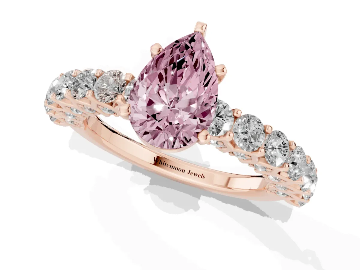 Fancy Pink Pear Cut Diamond Solitaire Ring with Shared Prong Pavé Band and Four-Prong Setting Rose gold