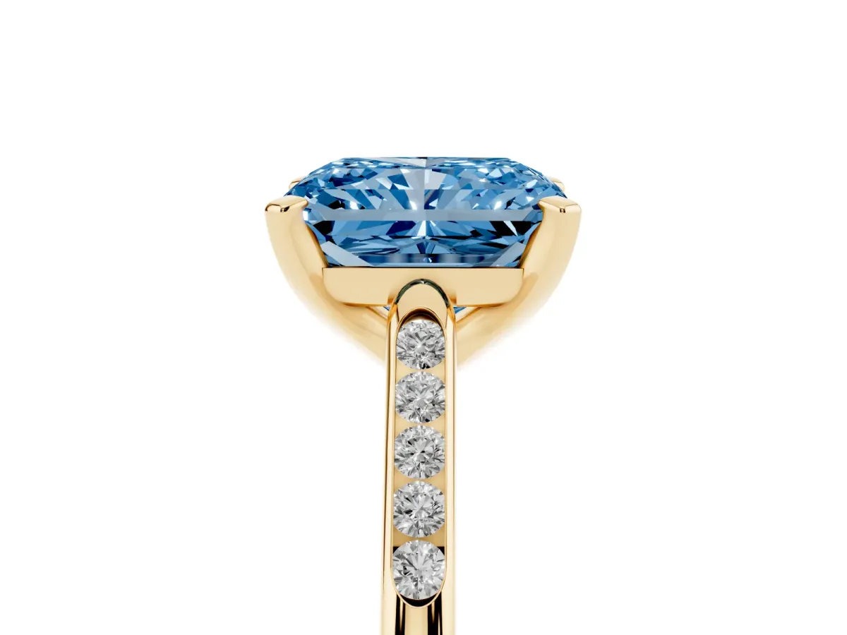 Fancy Blue Radiant Cut Diamond Solitaire Ring with Channel Set Round Band and Prong Setting Yellow gold