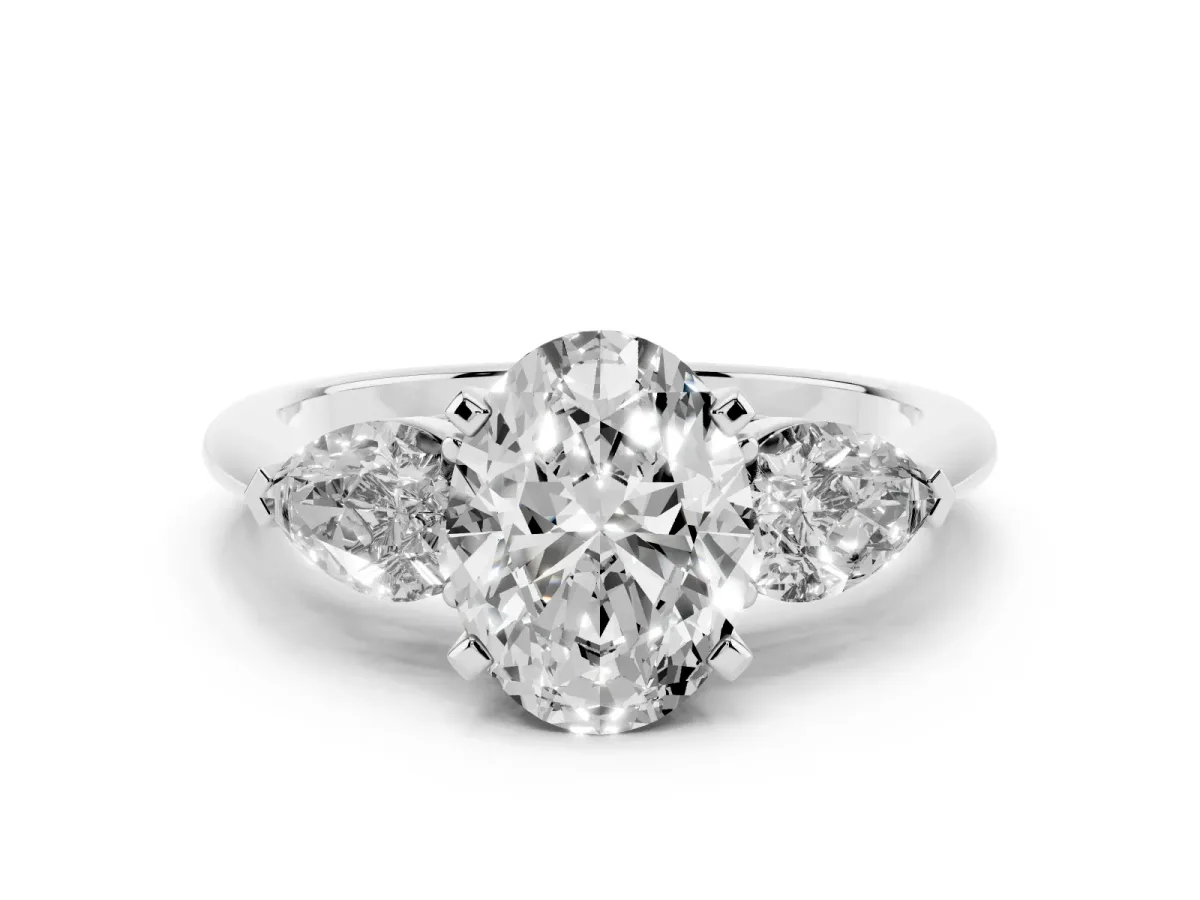 Three-Stone Oval Cut Diamond Ring with Pear Side Stones and Four-Prong Setting White gold