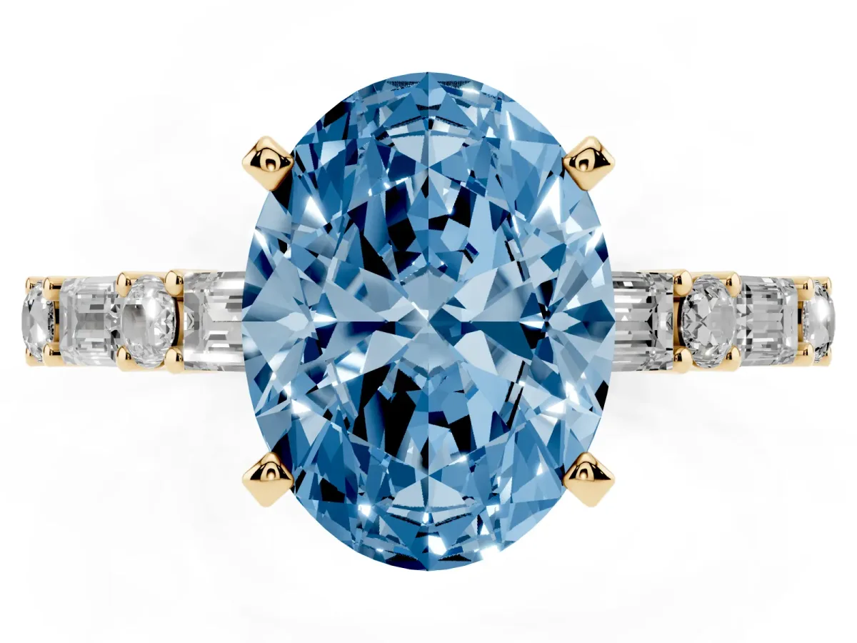Fancy Blue Oval Cut Diamond Solitaire with Side Baguettes and Channel Set Band Yellow gold