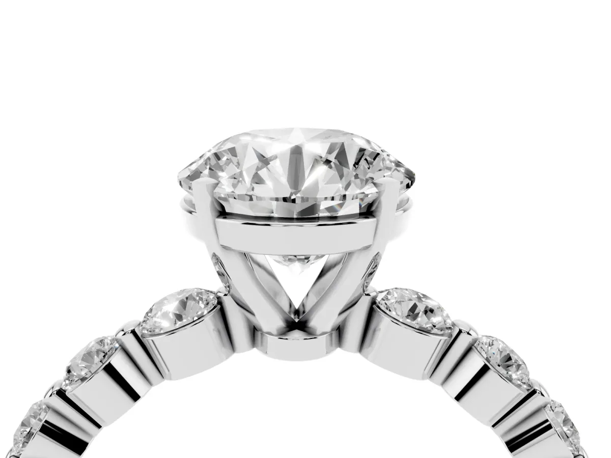 Round Cut Solitaire Diamond Ring with Pave Band and Four-Prong Setting Silver