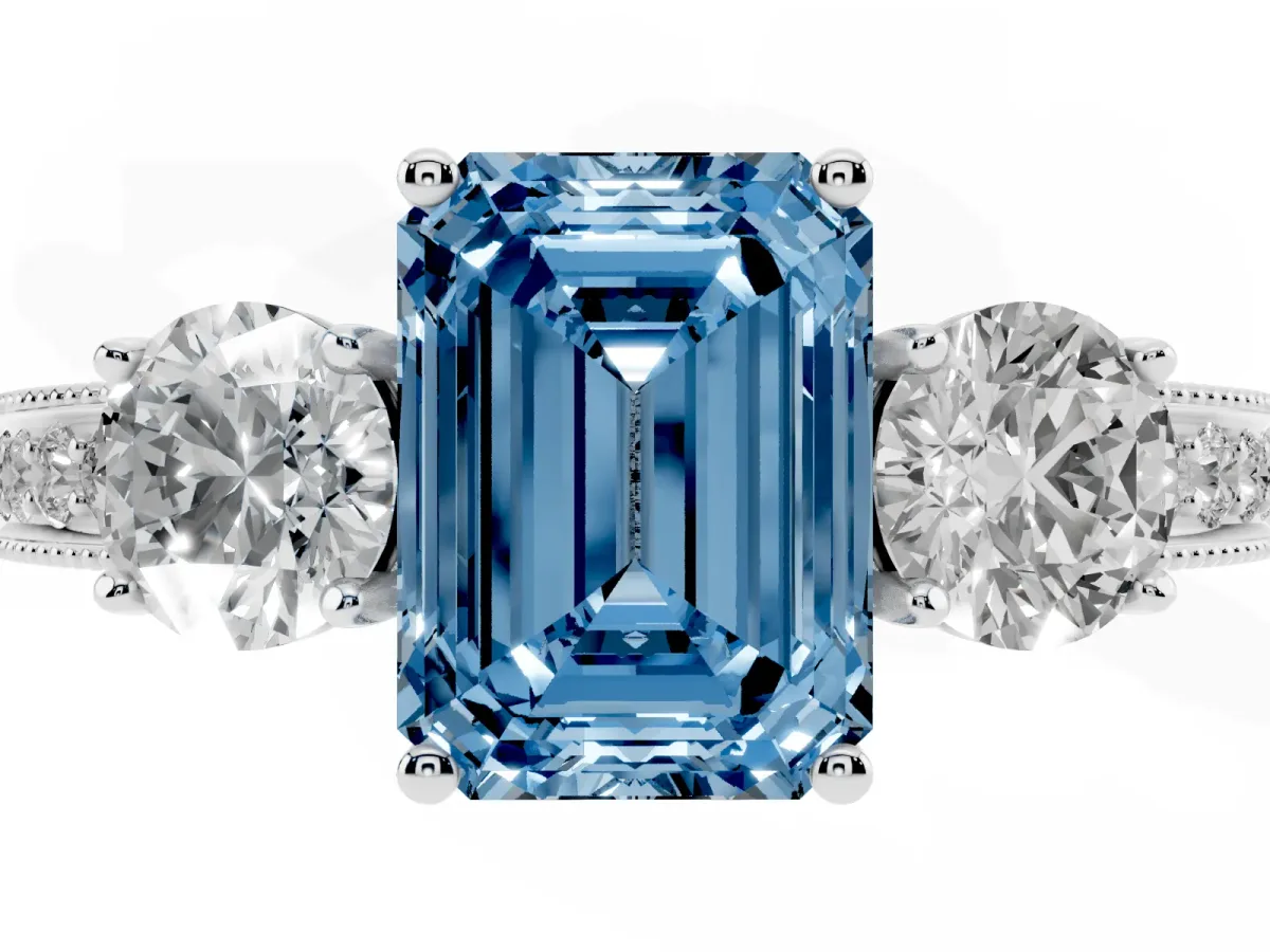 Fancy Blue Emerald Cut Three-Stone Diamond Ring with Pavé Band and Four-Prong Setting Silver
