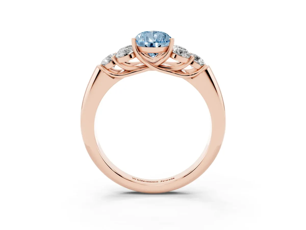 Fancy Blue Pear Cut Cut Diamond Cluster Ring with Round Accent Stones and Prong Setting on a Classic Band Rose gold
