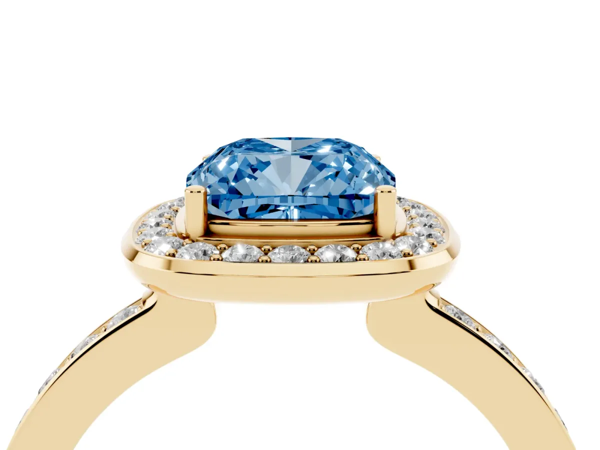 Fancy Blue Cushion Cut Diamond Halo Ring with Bezel Frame and Pavé Band Yellow gold