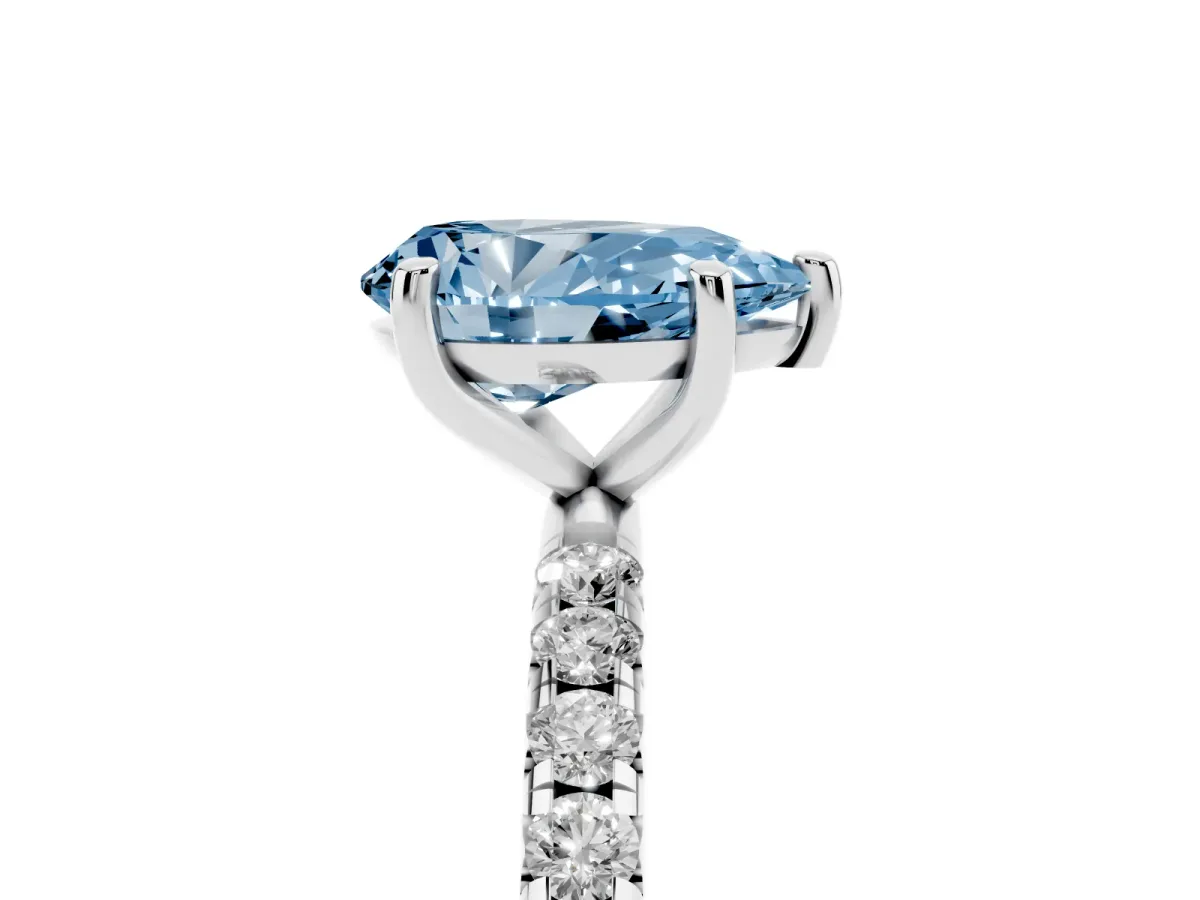 Fancy Blue Pear Cut Cut Diamond Solitaire Ring with Micro Pave Band and Four Prong Setting Silver