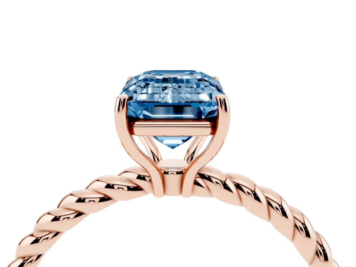 Fancy Blue Emerald Cut Solitaire Twist Band Ring with Four-Prong Setting Rose gold