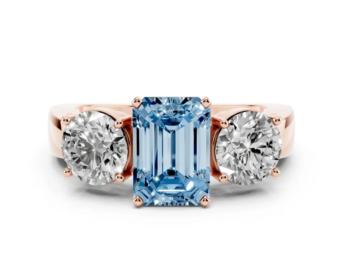 Fancy Blue Three-Stone Emerald Cut Diamond Ring with Round Side Stones, Classic Band, and Four-Prong Setting Rose gold