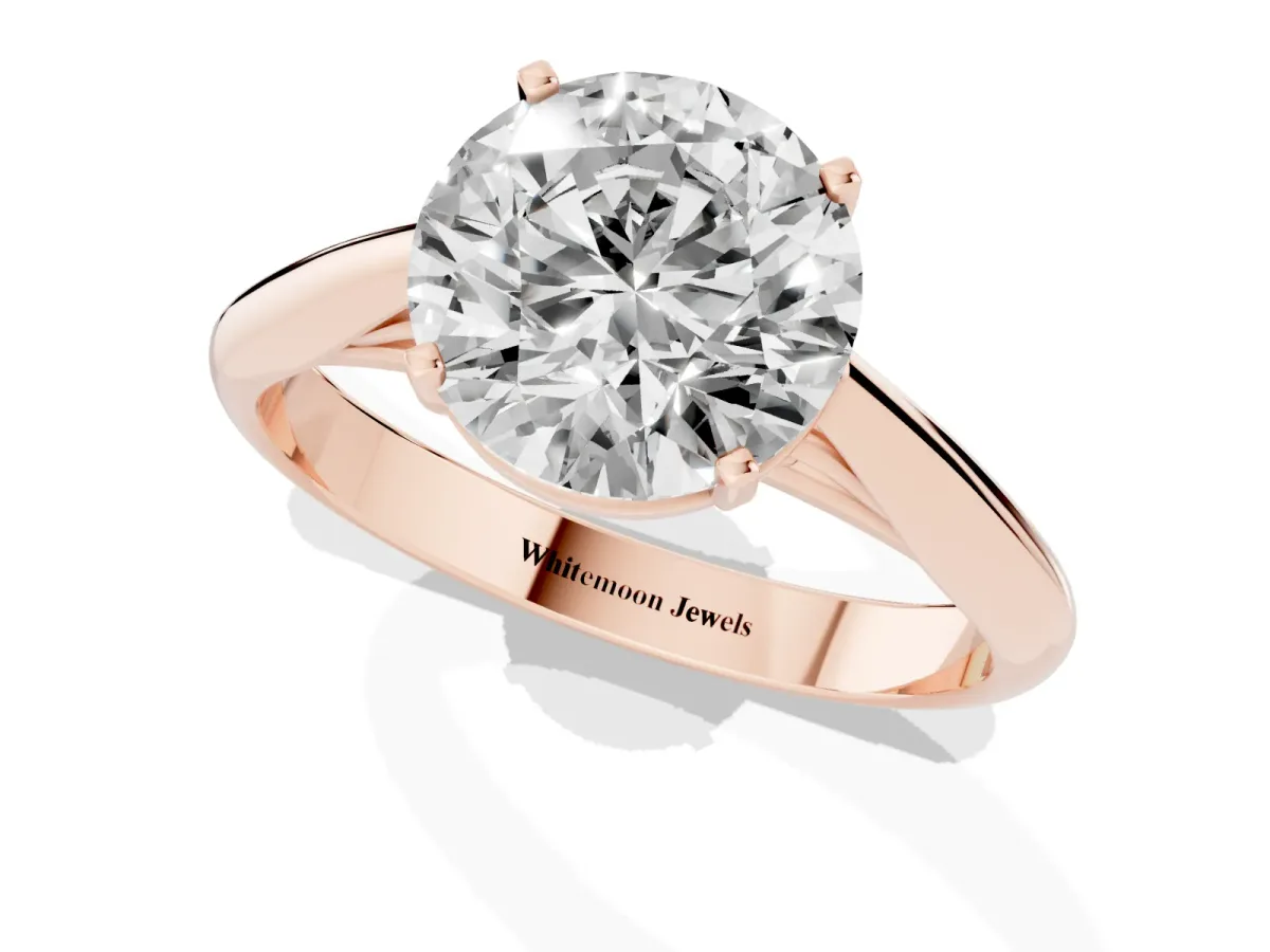 Round Cut Diamond Solitaire Engagement Ring with Cathedral Setting and Four-Prong Mount Rose gold