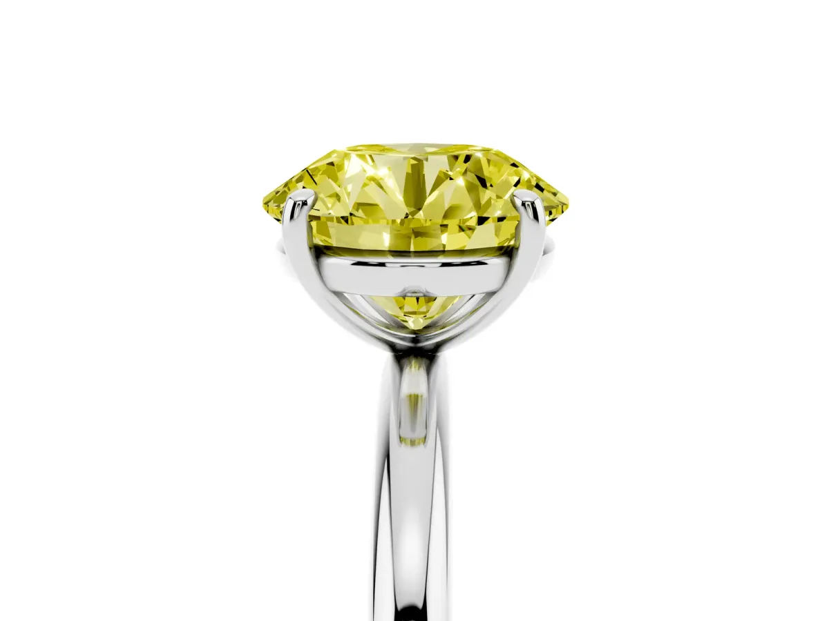 Fancy Yellow Round Cut Solitaire Diamond Ring with Four-Prong Setting on a Plain Band White gold