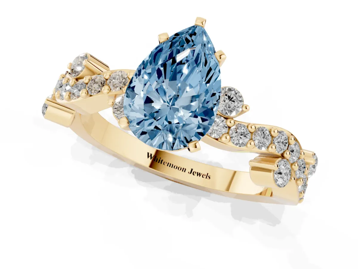 Fancy Blue Pear Cut Cut Solitaire Diamond Twisted Band with Pave Setting Yellow gold
