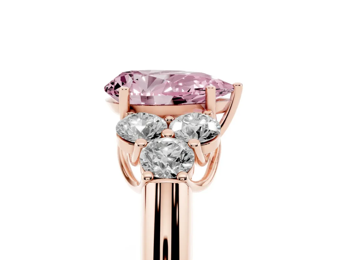 Fancy Pink Pear Cut Cut Diamond Cluster Ring with Round Accent Stones and Prong Setting on a Classic Band Rose gold