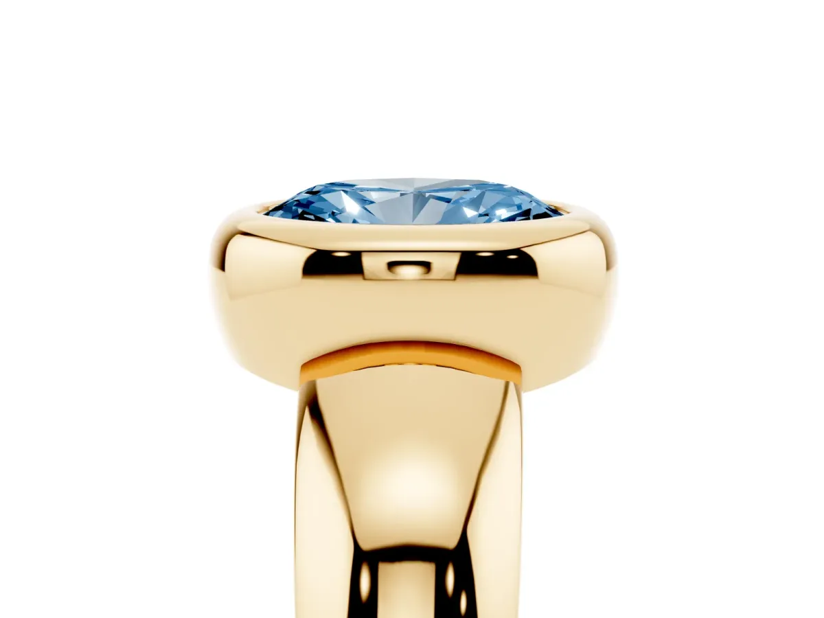 Fancy Blue Bezel Set Oval Cut Solitaire Ring with Wide Band Yellow gold